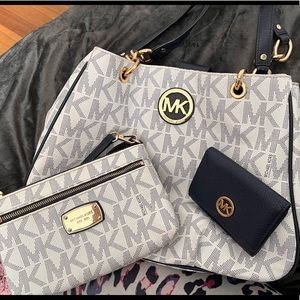 Navy blue and white MK Michael Kors purse with matching wristlet and card holder